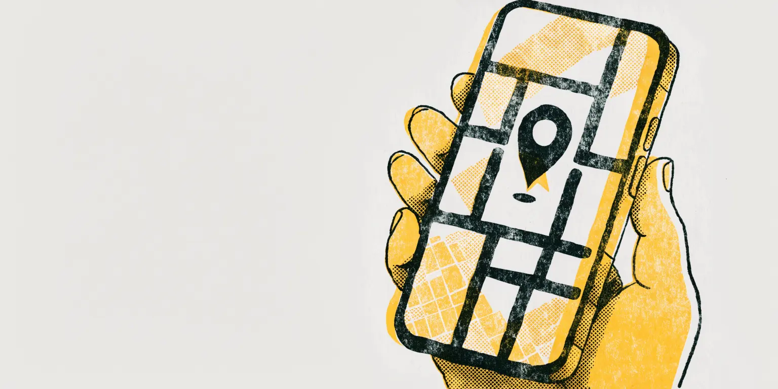 A hand holding a phone with a map and a single location pin, printed in yellow and charcoal on off-white paper
