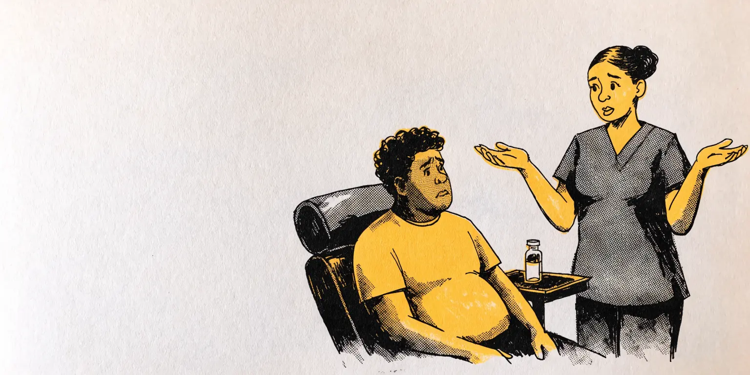 In a private clinic, a provider in charcoal scrubs shrugs apologetically with open palms beside a small medicine vial, while a seated patient looks on, slightly disappointed.
