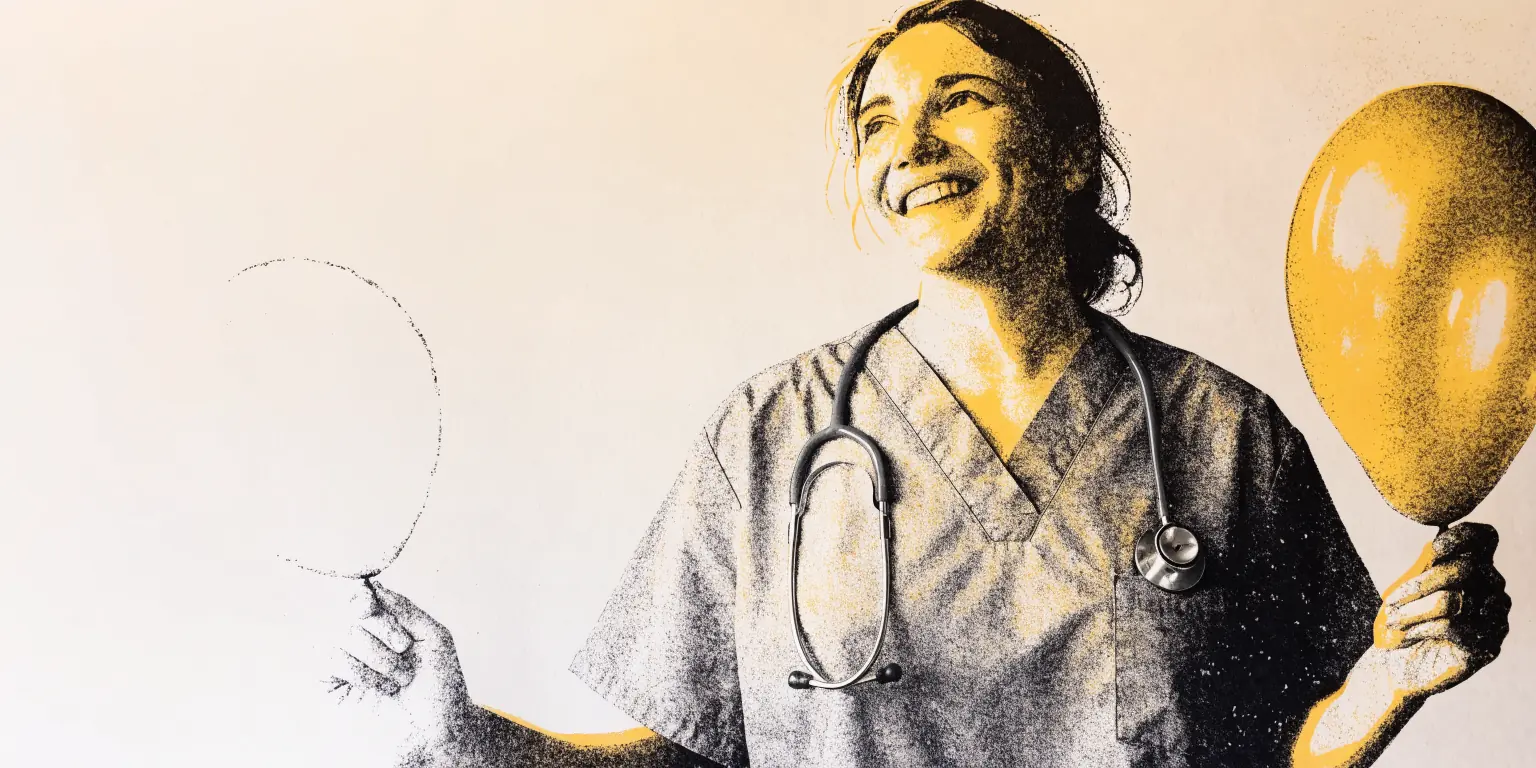 In a private clinic with walnut paneling and soft daylight, a smiling provider in charcoal scrubs, shown from the chest up, holds a deflated pale balloon in one hand and a tall, plump balloon in the other.
