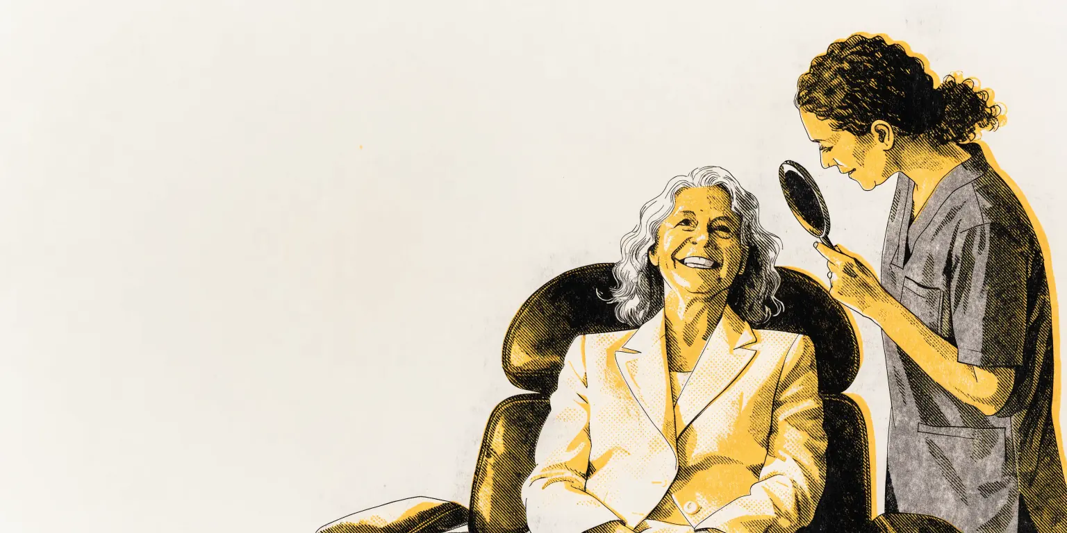 In a marble-and-walnut private clinic, a silver-haired woman in a cream blazer sits in a leather treatment chair, smiling, while a provider in charcoal scrubs holds a hand mirror beside her, both waist-up.