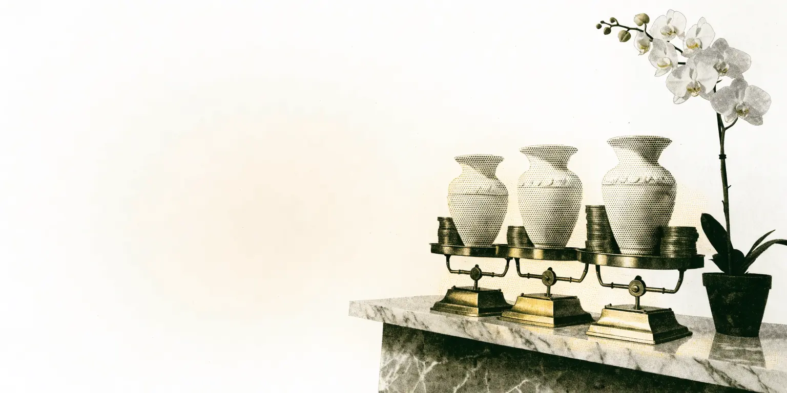 On a marble clinic reception counter, a row of three brass weighing scales holds three identical porcelain vases, each balanced by a different-sized stack of gold coins, beside a single orchid in soft daylight.
